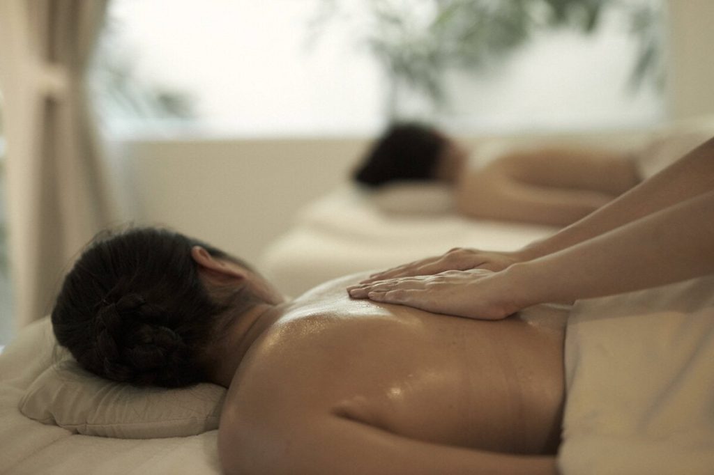 A woman receiving an aromatherapy oil massage