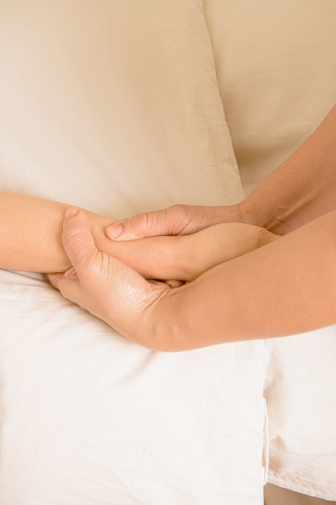 Lymphatic drainage arm massage at a White Wood Green spa with therapist’s hands on client’s arm.